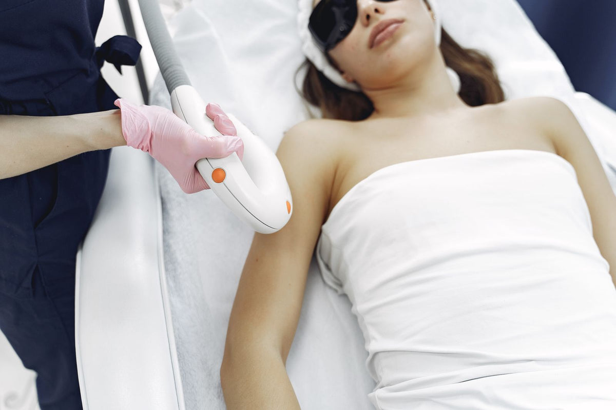 Woman wearing protective eyewear during a laser hair removal treatment